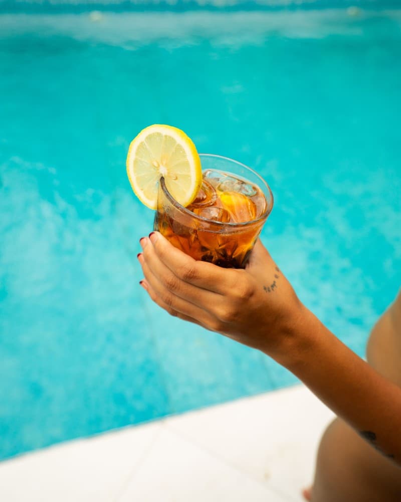 Tropical cocktail garnished with fresh fruit at the Villa Cali Siargao bar