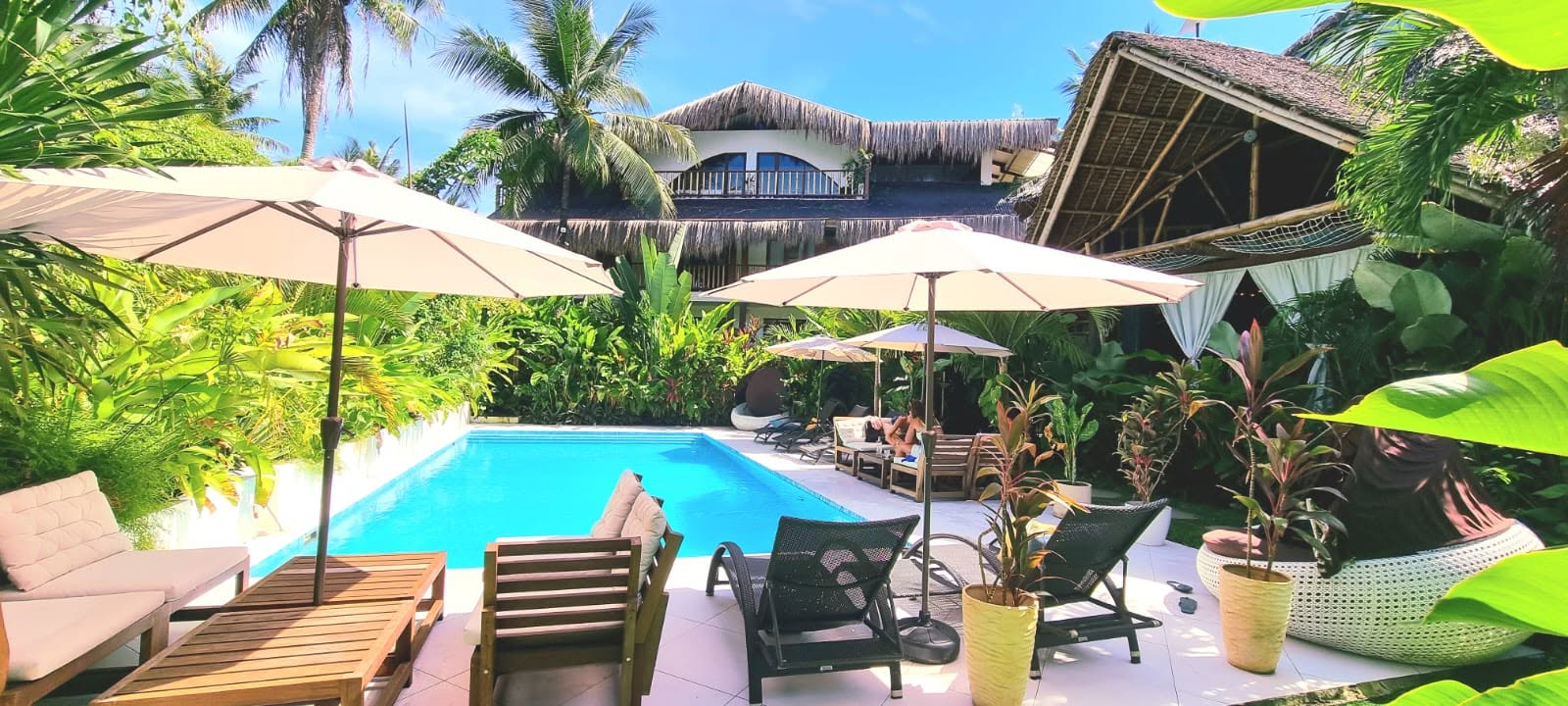 Villa Cali Siargao — tropical garden, palms and pool in General Luna, Siargao