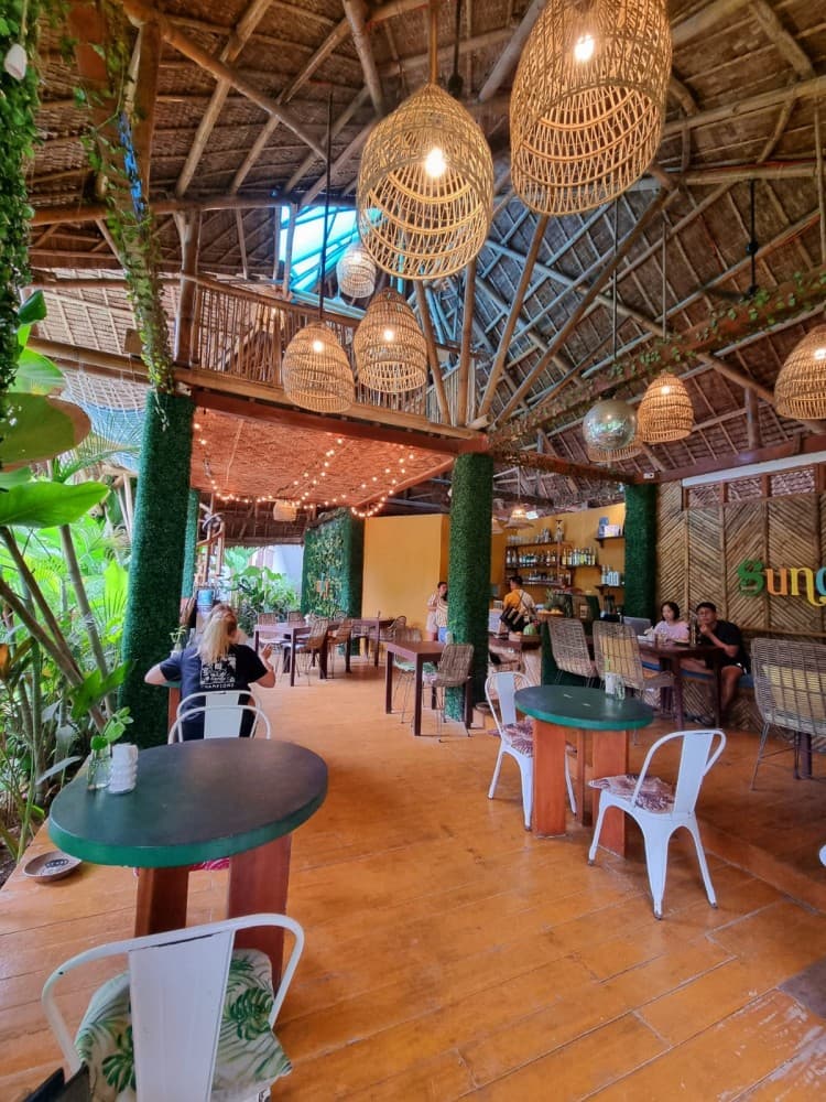 Open-air garden restaurant under the palms at Villa Cali Siargao
